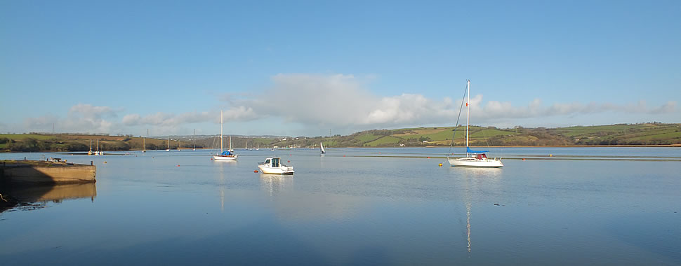 Views up river from the quay at Cargreen